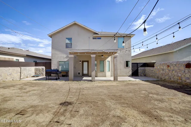 a view of a house with porch and a garage