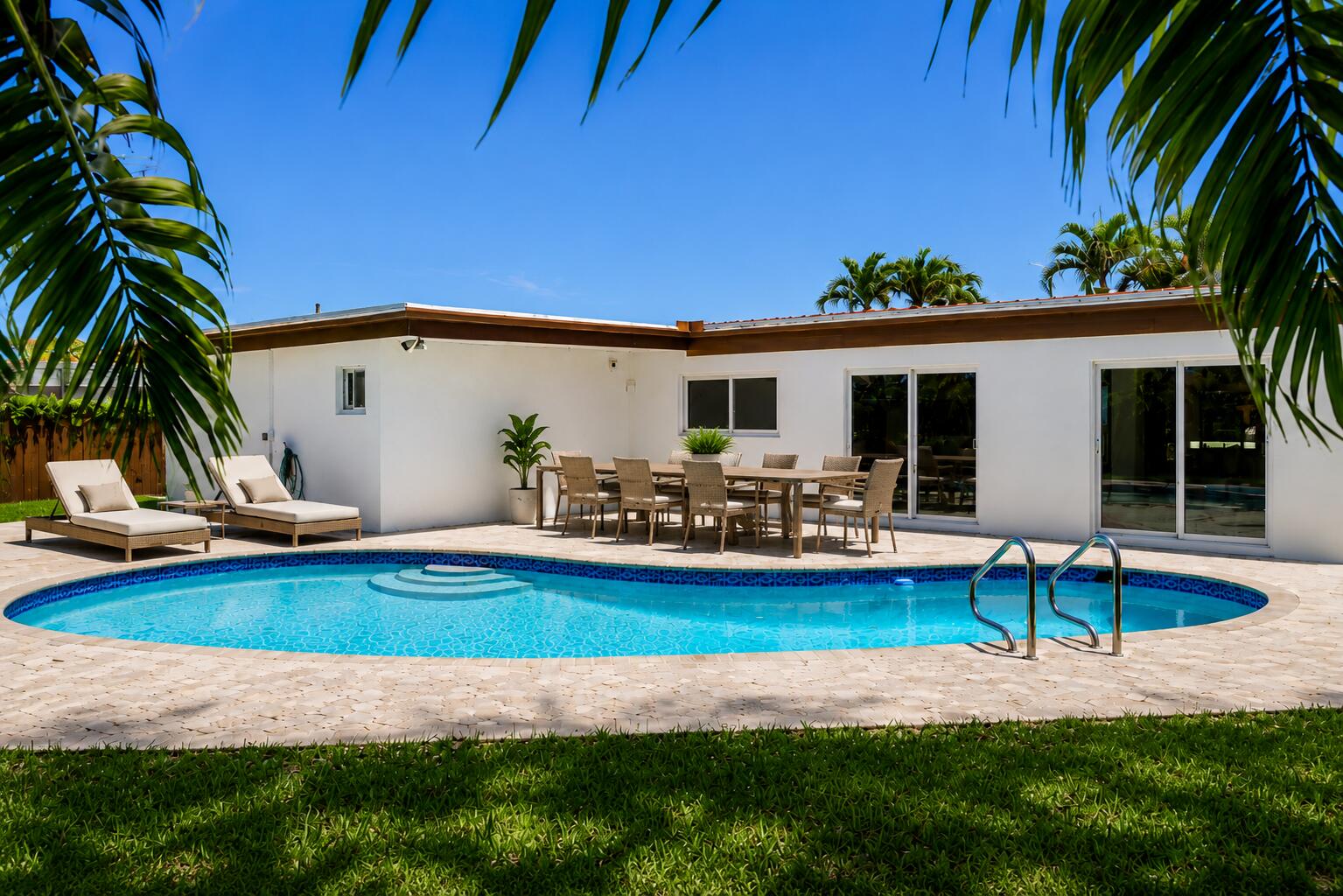 4815 Cleveland Street Hollywood, FL 33021 - Photo 29 of 31 a view of a house with swimming pool and sitting area