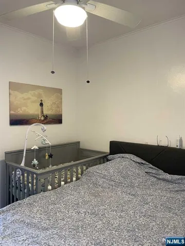 a bedroom with a bed and chair