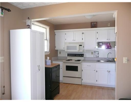 446 Zeigler Road Rochester, PA 15074 - Photo 5 of 15 Kitchen. ALL NEUTRAL COLORS, NEWER LAMINATE WOOD FLOORING AND MICROWAVE. PORTABLE DISHWASHER IS INCLUDED ALONG WITH STOVE AND REFRIGERATOR.