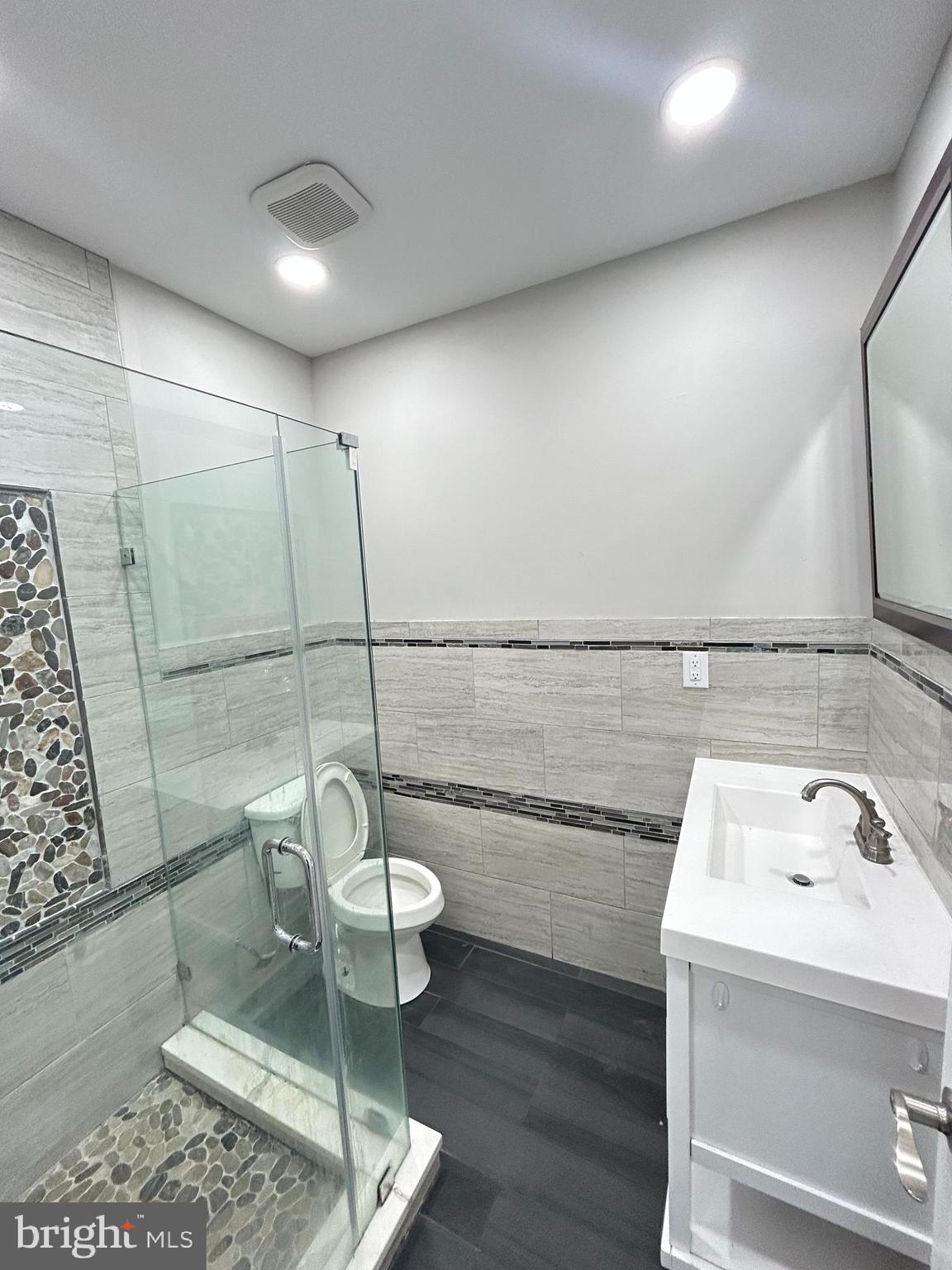 2417 North 54th Street, Unit D Philadelphia, PA 19131 - Photo 7 of 13 a bathroom with a sink and a mirror