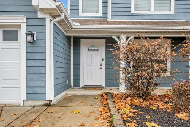 a front view of a house with a garage