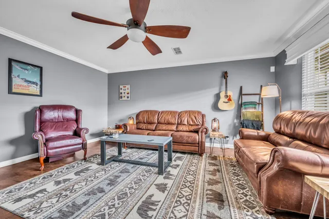 a living room with furniture and a rug