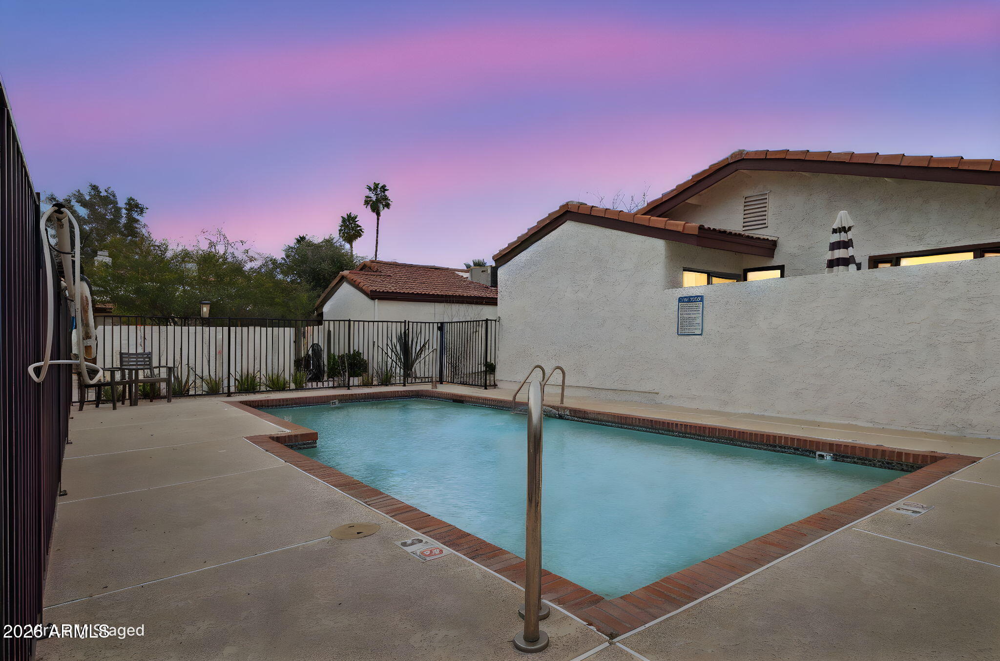 4343 East Osborn Road Phoenix, AZ 85018 - Photo 31 of 41 a front view of a house with swimming pool and a yard