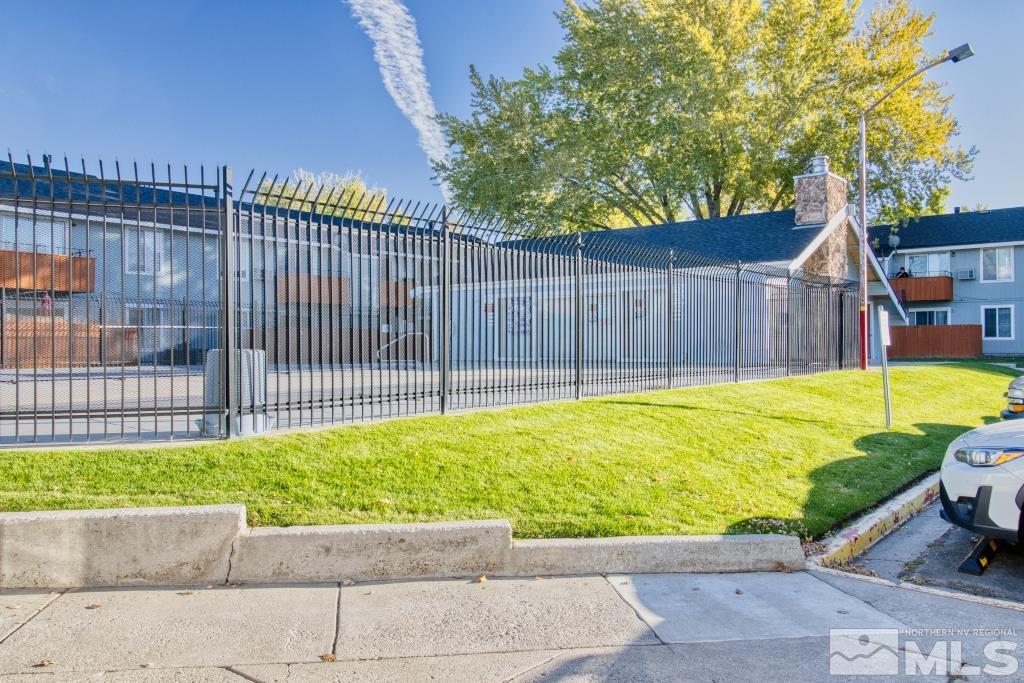 4604 Neil Road, Unit 102 Reno, NV 89502 - Photo 24 of 24 a view of a backyard with a small pool