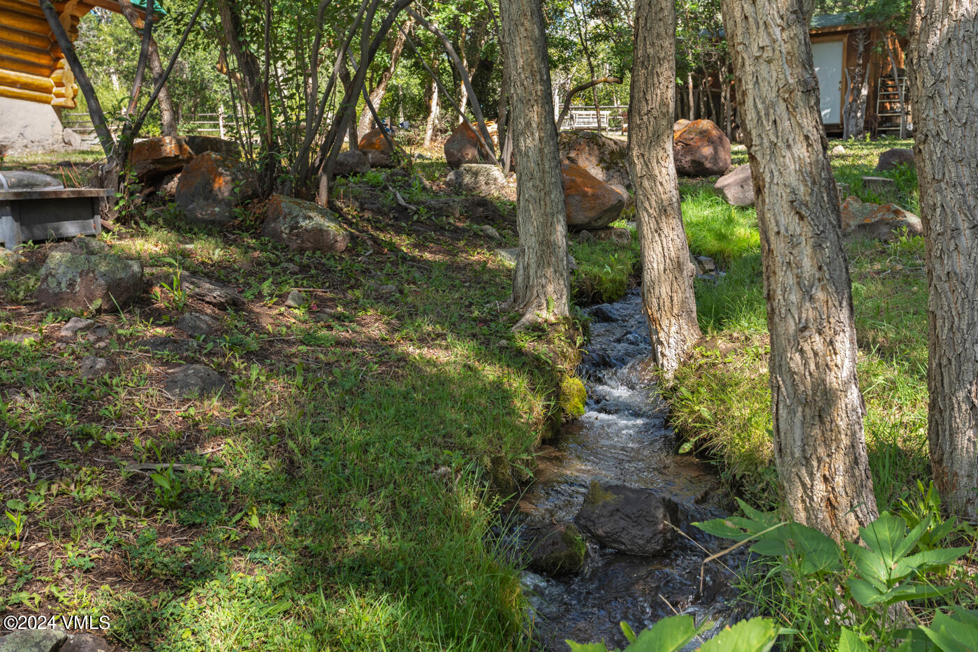150 County Road Gypsum, CO 81637 - Photo 12 of 43 a backyard of a house with lots of green space