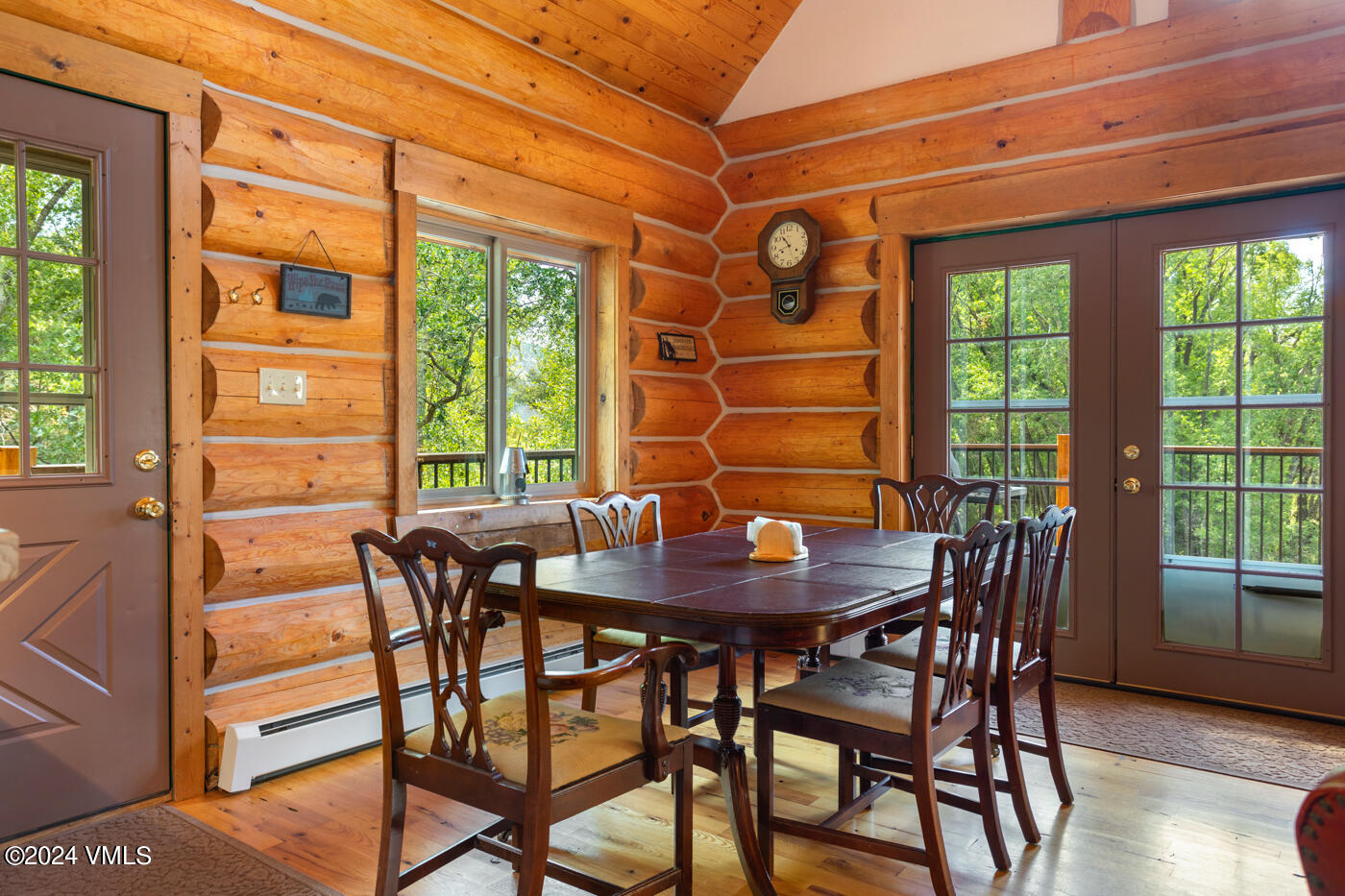 150 County Road Gypsum, CO 81637 - Photo 23 of 43 a view of a dining room with furniture and wooden floor