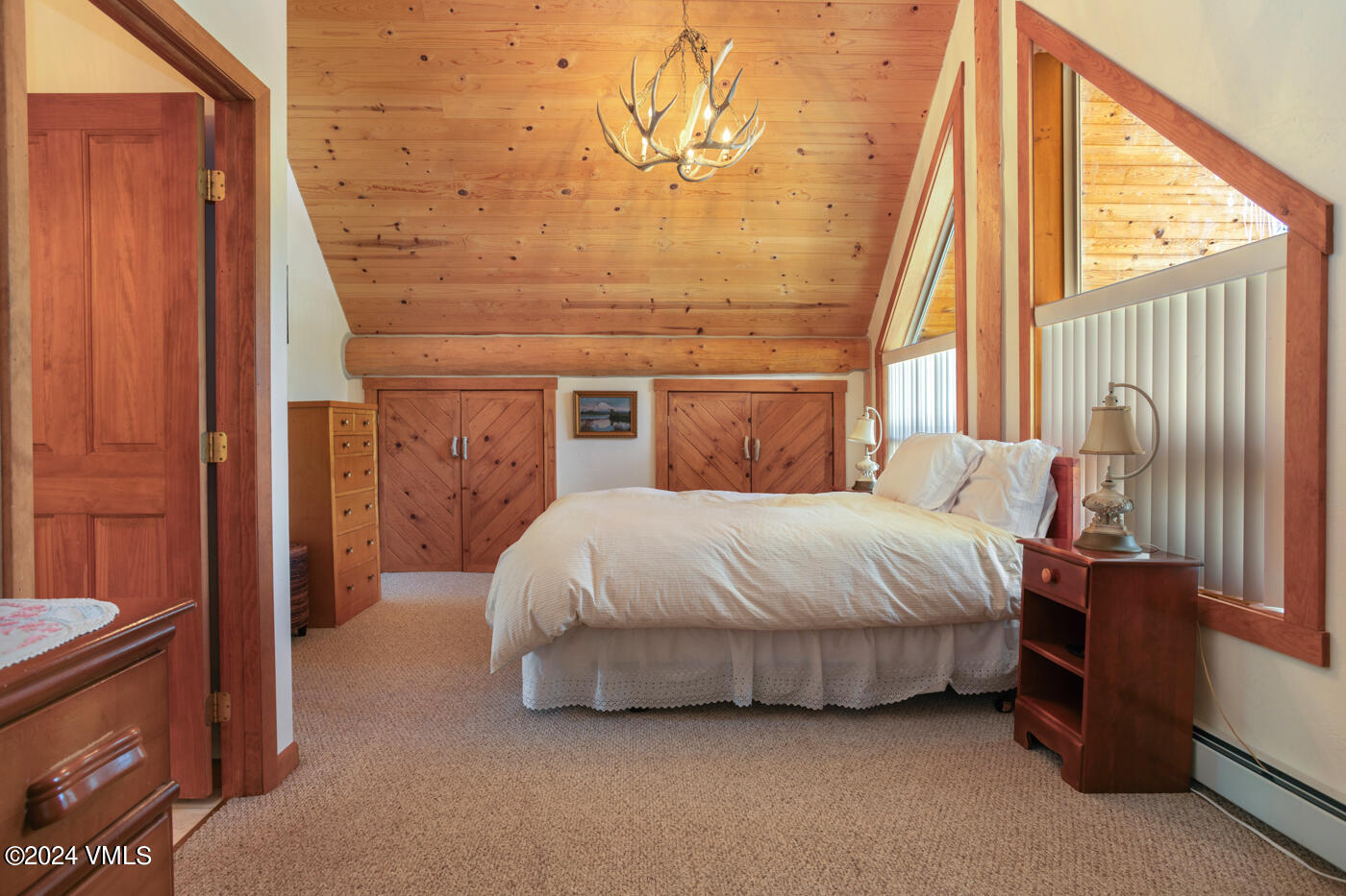 150 County Road Gypsum, CO 81637 - Photo 28 of 43 a spacious bedroom with a bed and a window