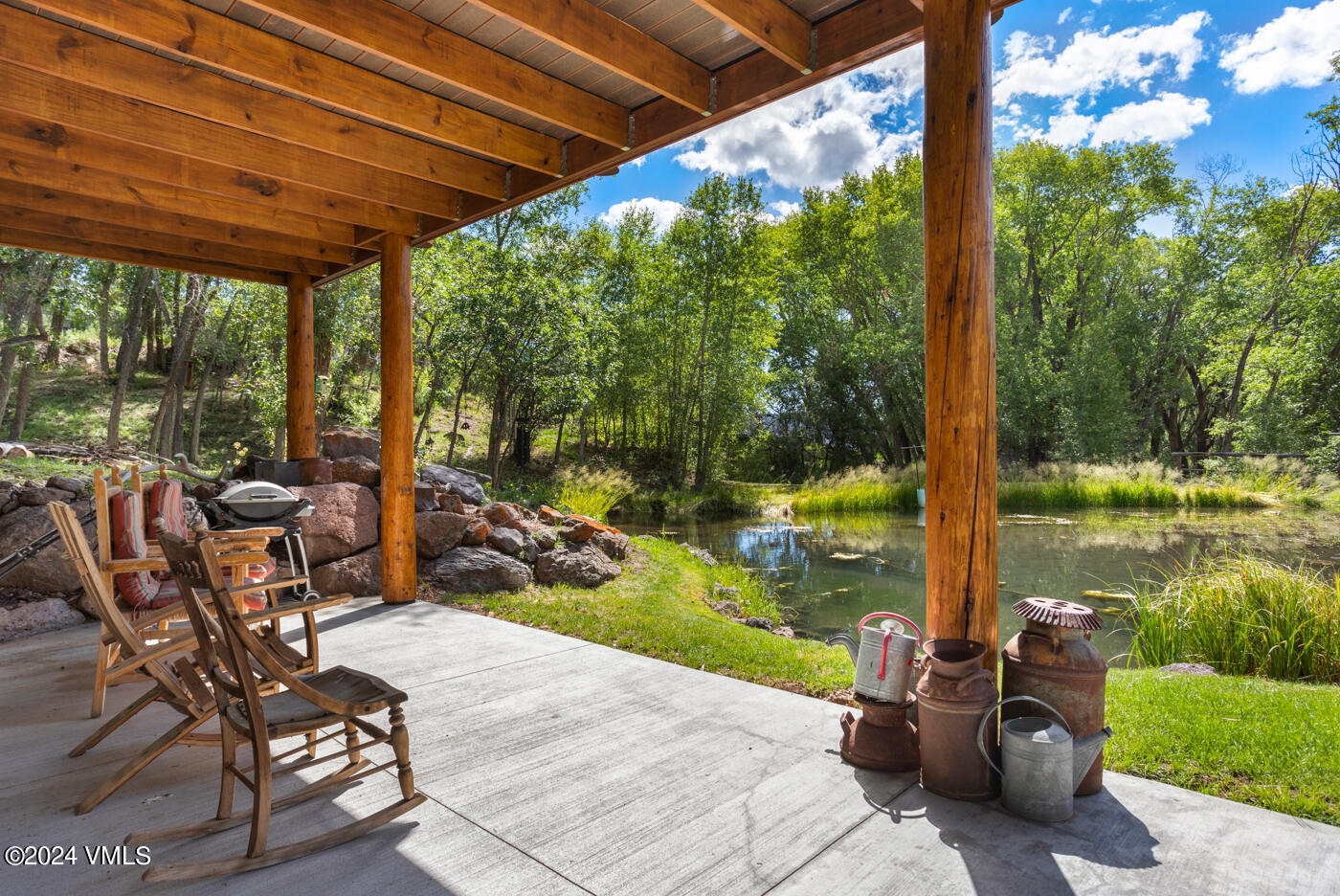 150 County Road Gypsum, CO 81637 - Photo 35 of 43 a view of a patio with table and chairs potted plants with large tree
