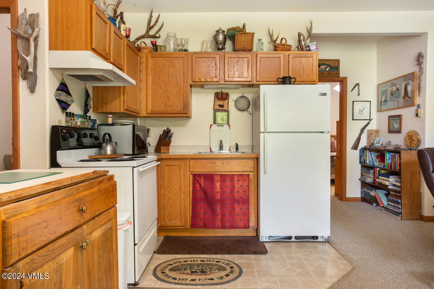 150 County Road Gypsum, CO 81637 - Photo 38 of 43 a view of a kitchen with fridge and workspace