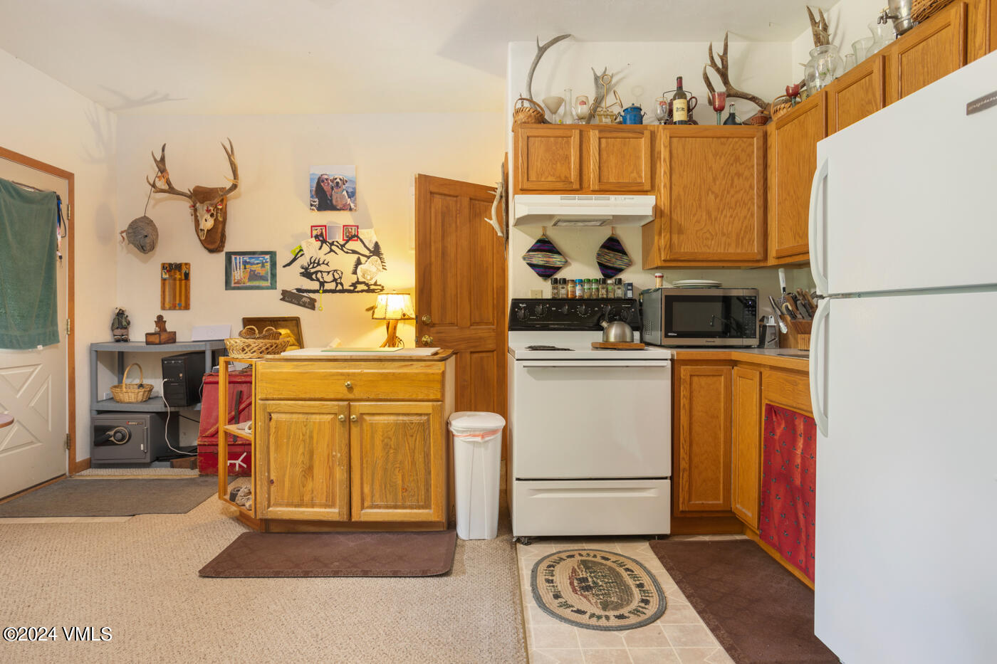 150 County Road Gypsum, CO 81637 - Photo 39 of 43 a view of a kitchen with appliances and cabinets