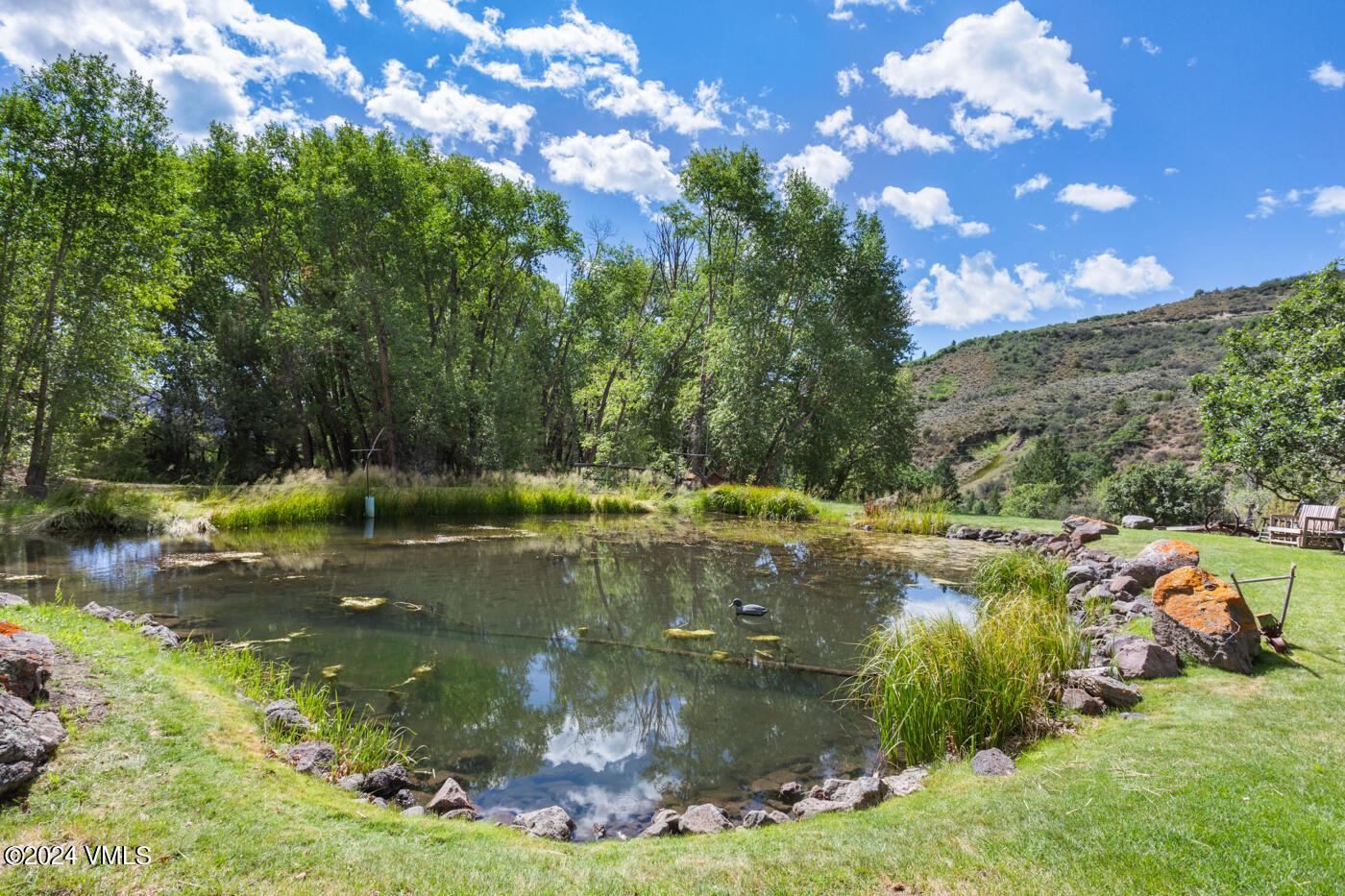 150 County Road Gypsum, CO 81637 - Photo 9 of 43 a view of a lake with houses