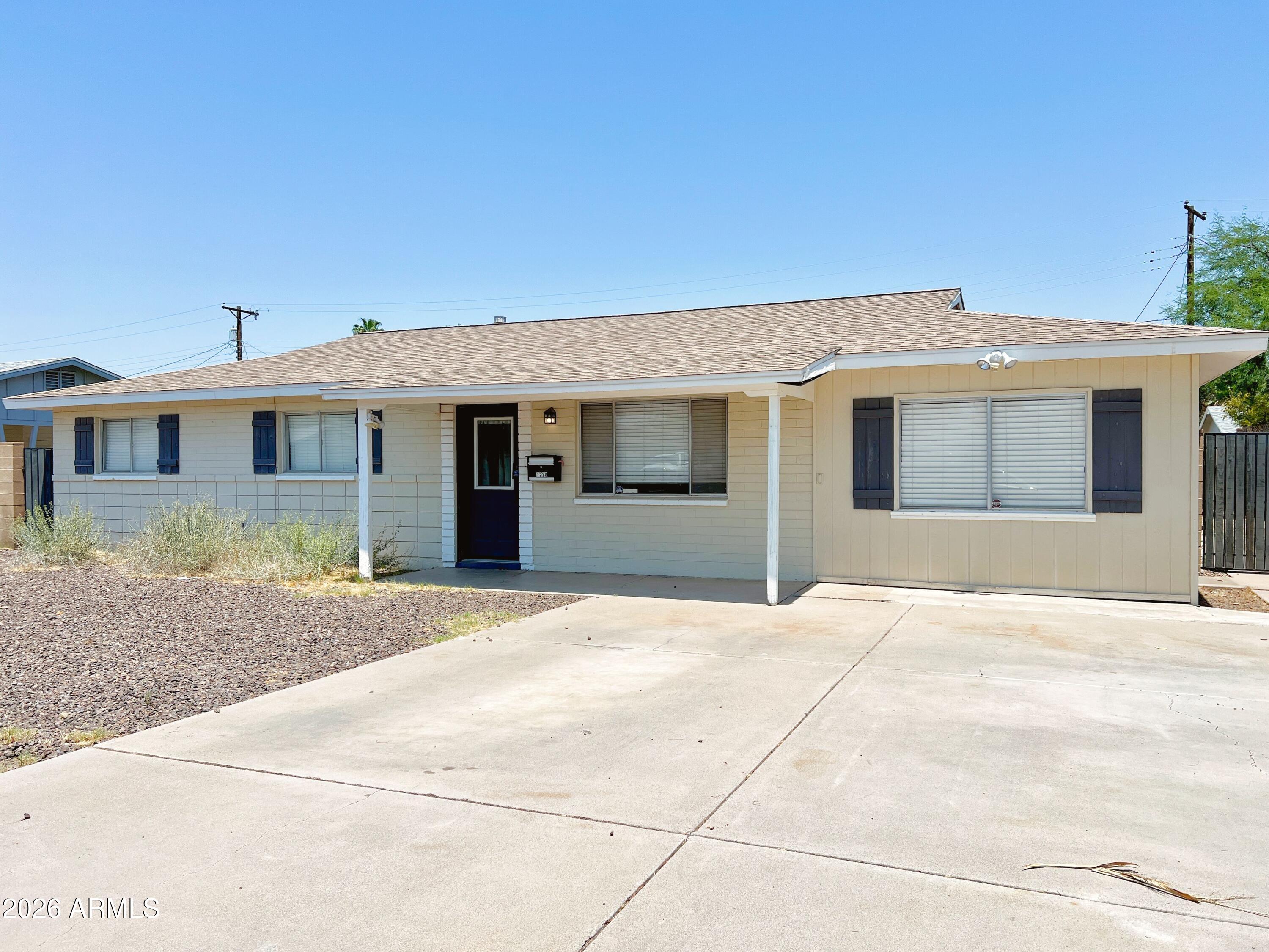 1220 West Romo Jones Street Tempe, AZ 85281 - Photo 2 of 26 a front view of a house with yard