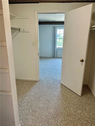 a view of a hallway with closet