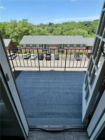 a balcony with a yard