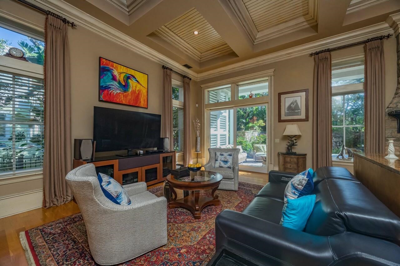 924 Ocean Palm Way St. Augustine, FL 32080 - Photo 20 of 81 a living room with fireplace furniture and a flat screen tv