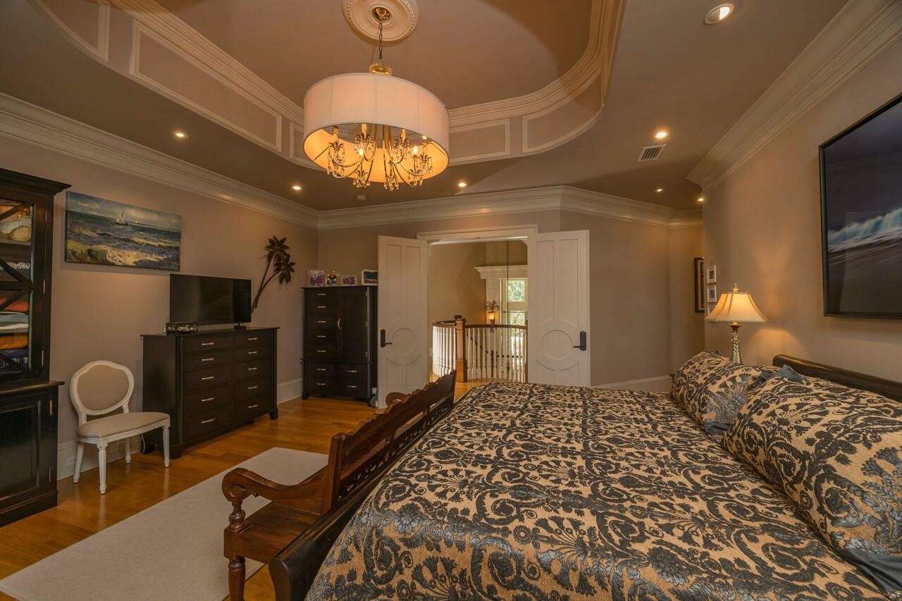 924 Ocean Palm Way St. Augustine, FL 32080 - Photo 38 of 81 a living room with furniture a flat screen tv and kitchen view