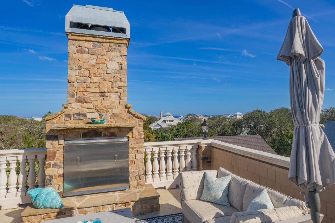 924 Ocean Palm Way St. Augustine, FL 32080 - Photo 56 of 81 a view of a balcony with chair and wooden floor