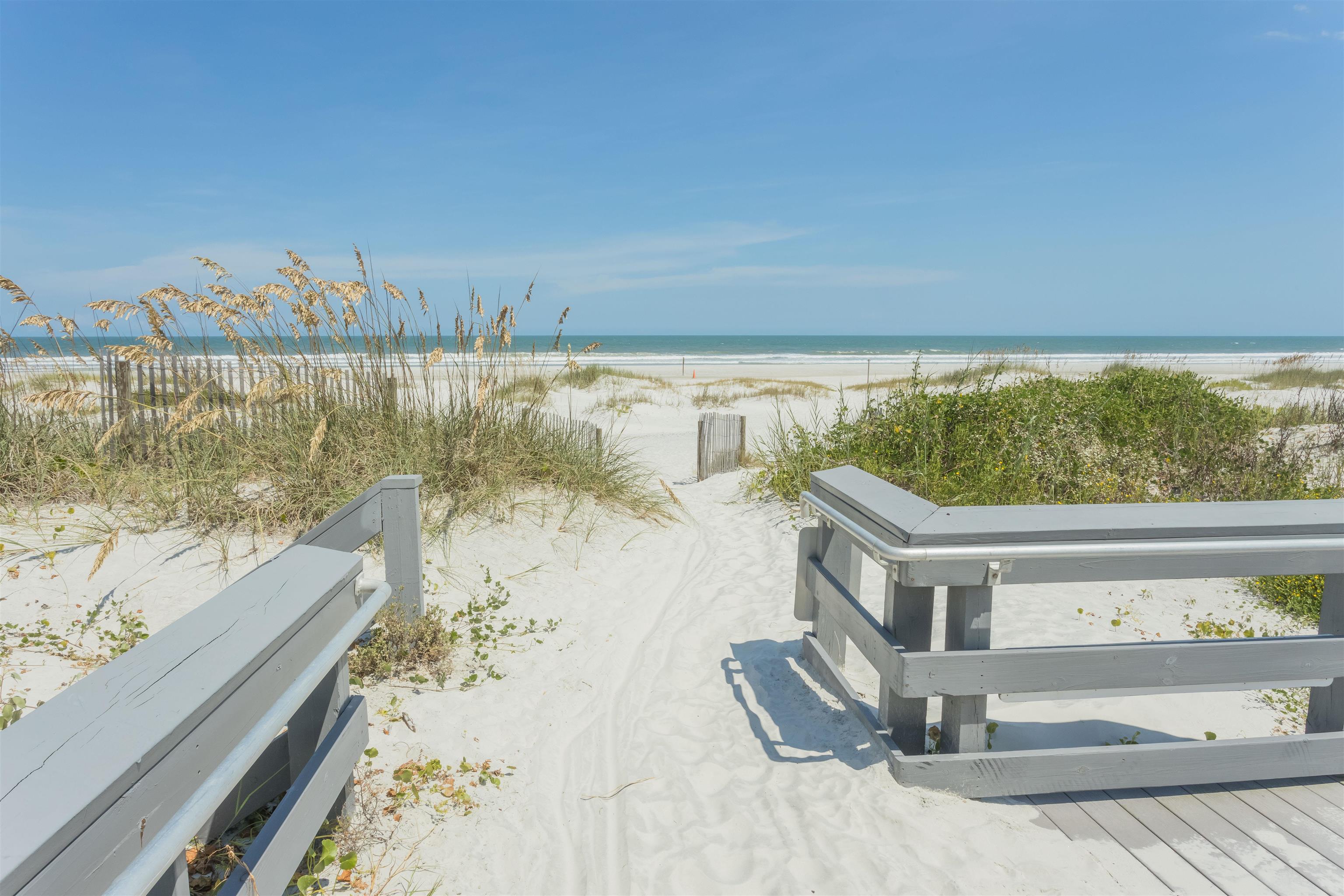 924 Ocean Palm Way St. Augustine, FL 32080 - Photo 65 of 81 a view of a terrace with wooden floor and a lake view