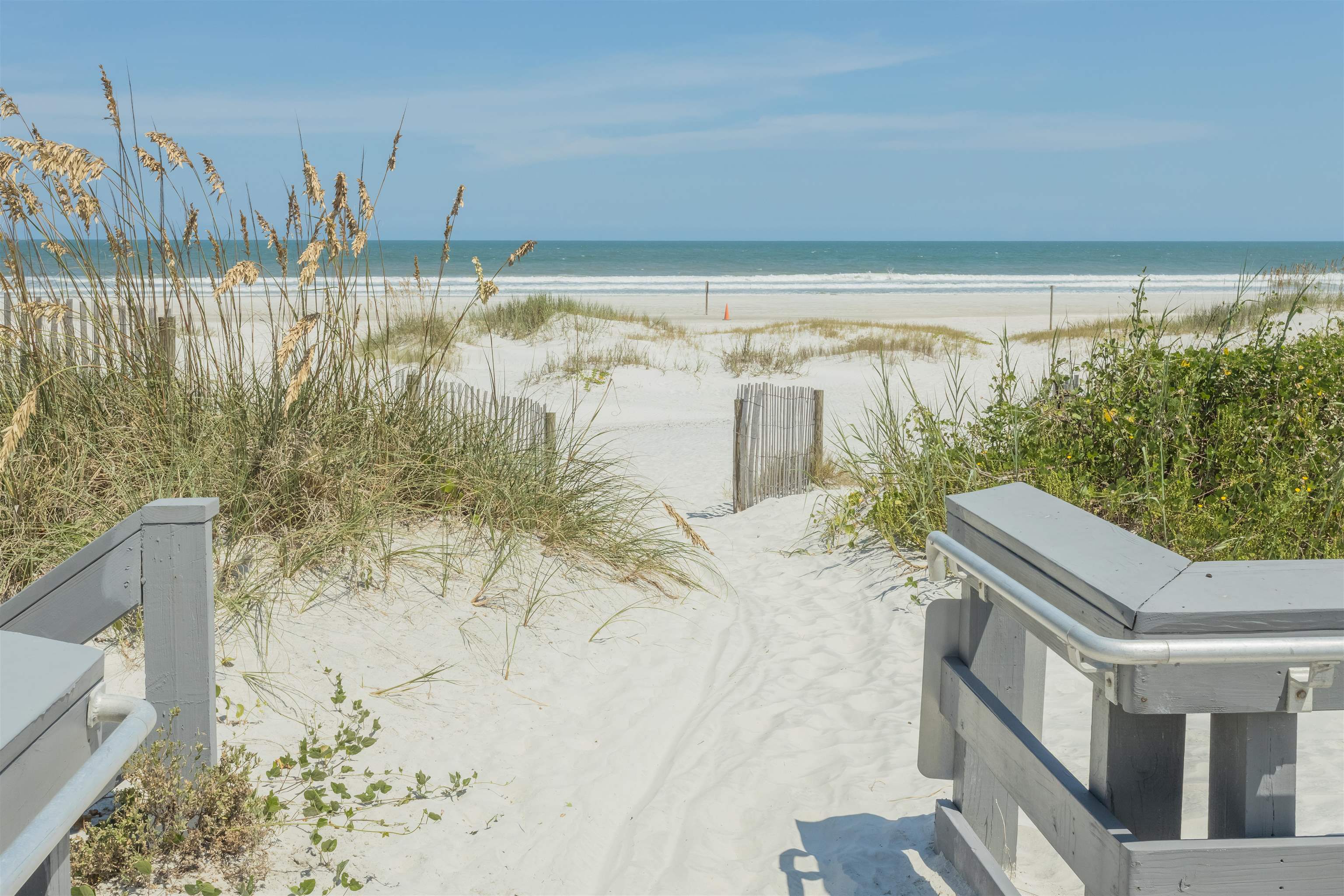 924 Ocean Palm Way St. Augustine, FL 32080 - Photo 67 of 81 a view of a balcony with table and chairs and wooden floor