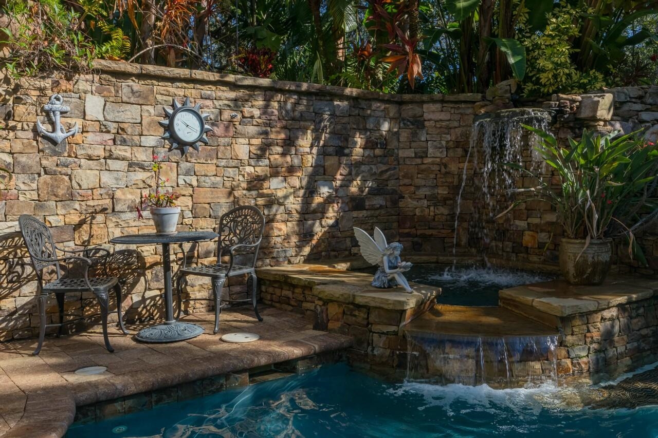 924 Ocean Palm Way St. Augustine, FL 32080 - Photo 7 of 81 a backyard of a house with lots of green space and trees