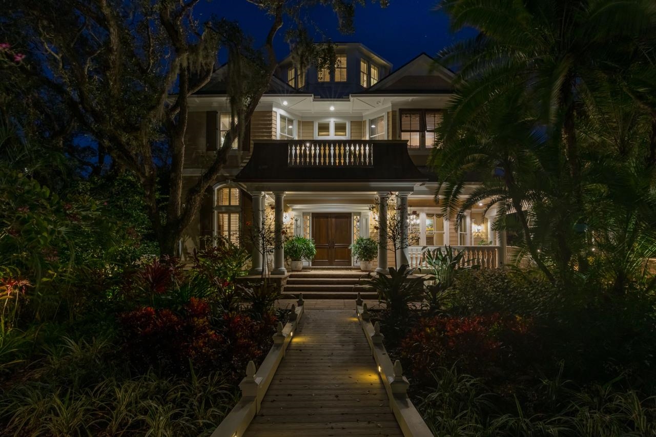 924 Ocean Palm Way St. Augustine, FL 32080 - Photo 8 of 81 a view of a house with a small yard and large trees
