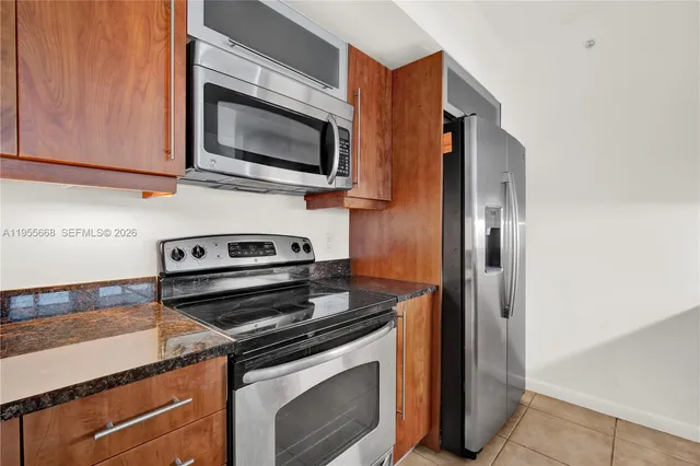 a kitchen with a stove and a microwave