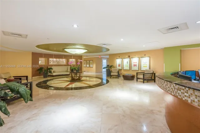 a spacious bedroom with a bed and a couch