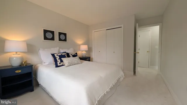 a bedroom with a bed and a night lamp