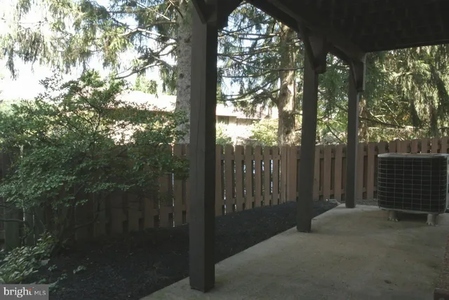 a view of a tree in front of a house