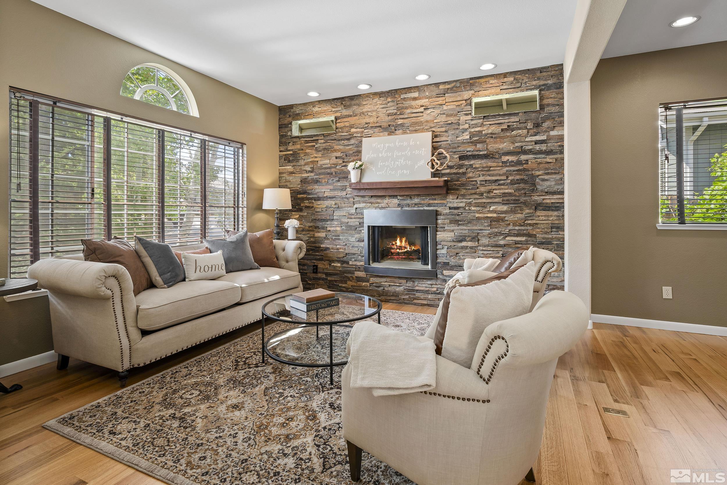 6460 Brookview Circle Reno, NV 89519 - Photo 5 of 35 a living room with furniture windows and a fireplace