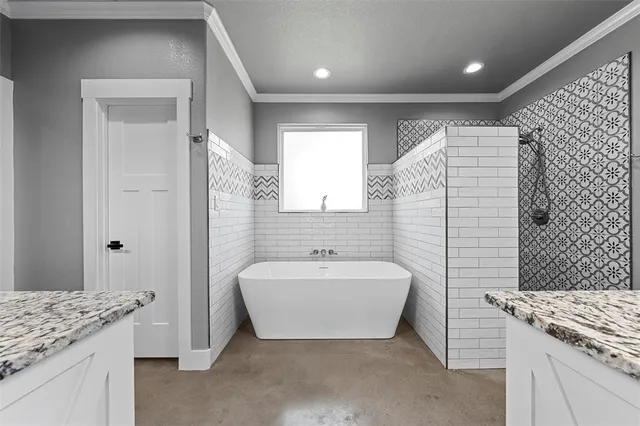a spacious bathroom with a sink and a mirror