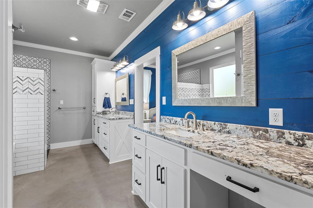 370 Rio Bonito Drive Robinson, TX 76706 - Photo 18 of 39 a bathroom with a sink vanity and a mirror