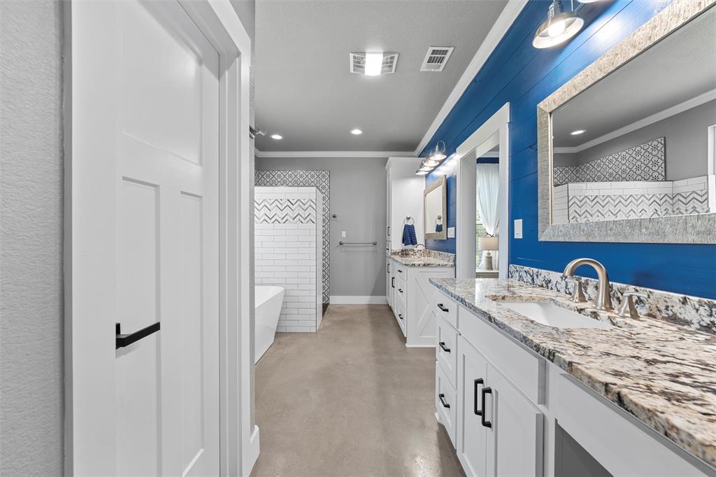 370 Rio Bonito Drive Robinson, TX 76706 - Photo 19 of 39 a bathroom with a double vanity sink and mirror
