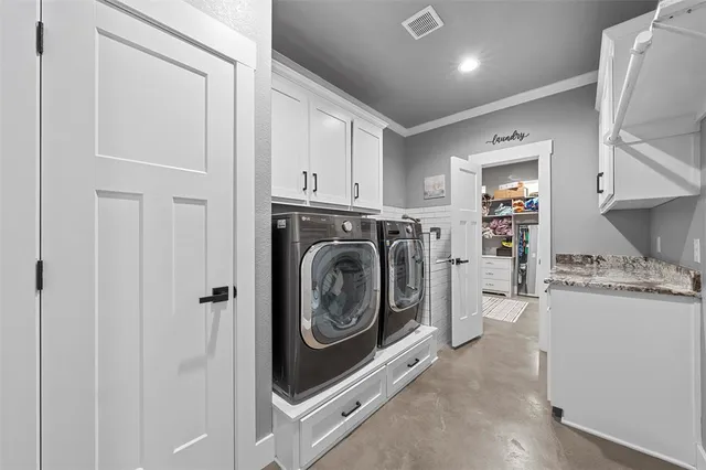 a view of a kitchen with washer and dryer