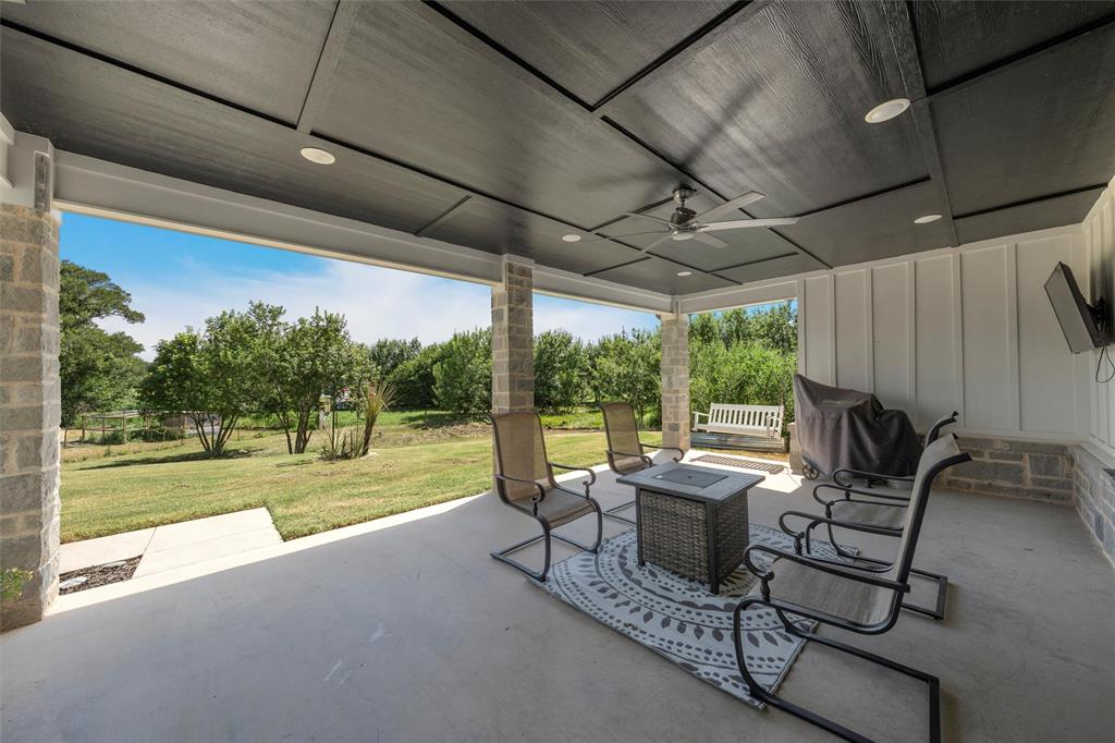 370 Rio Bonito Drive Robinson, TX 76706 - Photo 29 of 39 a view of a patio with table and chairs and couches with wooden floor