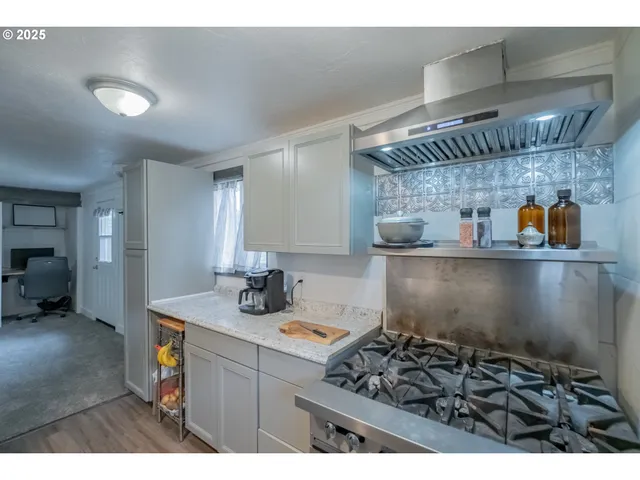 a kitchen with a sink and cabinets