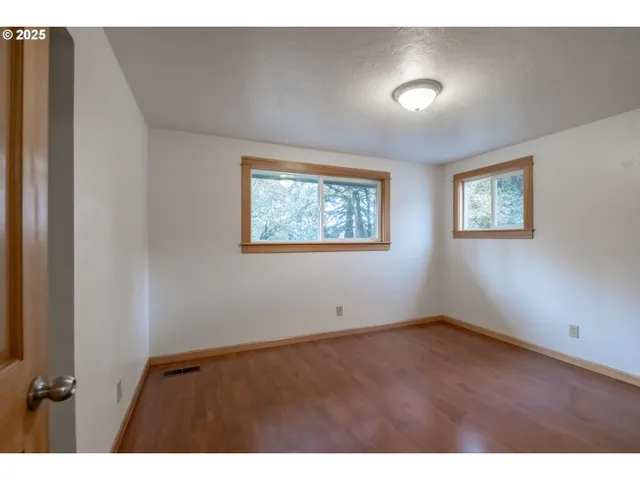 a view of empty room with windows