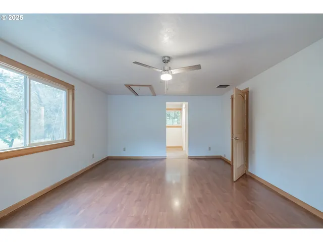 a view of an empty room with a window