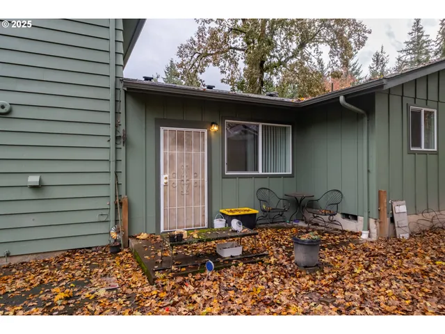 a side view of a house with a patio
