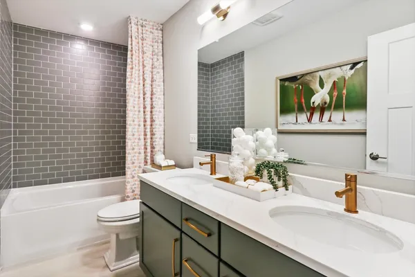 a bathroom with a sink a toilet and bathtub