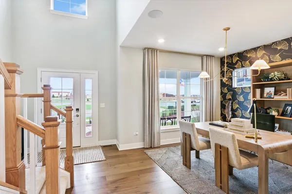 a view of a dining room with furniture window and wooden floor