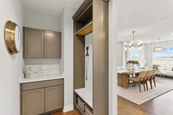 a view of living room kitchen with furniture and wooden floor