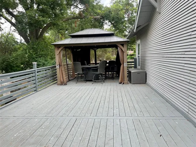 a view of backyard with sitting area