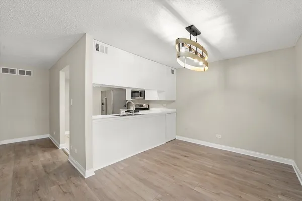 a view of kitchen and sink