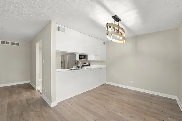 a view of kitchen and sink
