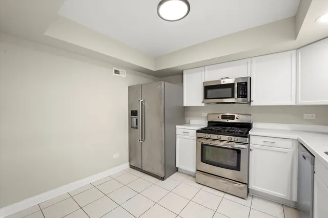 a kitchen with a stove microwave and refrigerator