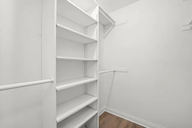 a view of an empty walk in closet