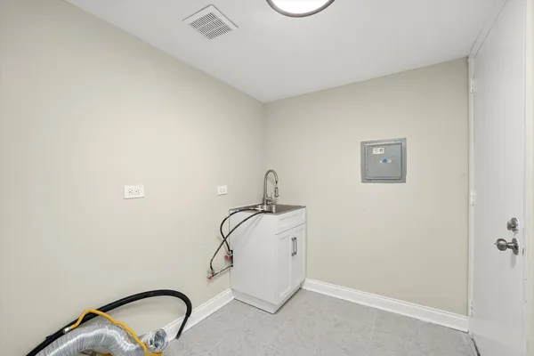 a bathroom with a sink and mirror