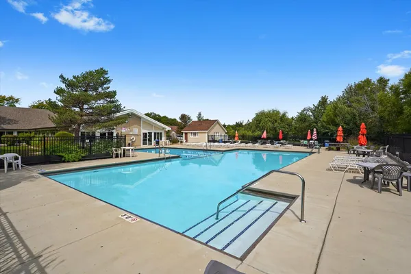 a view of swimming pool with chairs